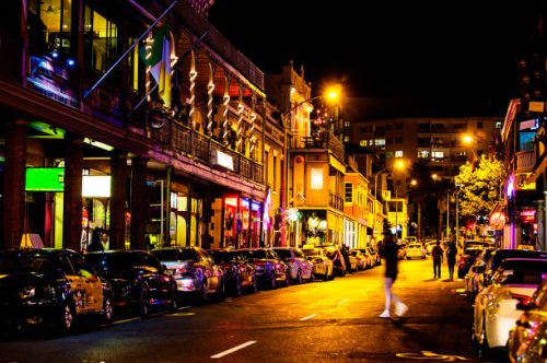 colorful lit downtown street at night. long st, cape town, south africa
